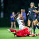 Lauren Kellett (1) makes a diving save in traffic.